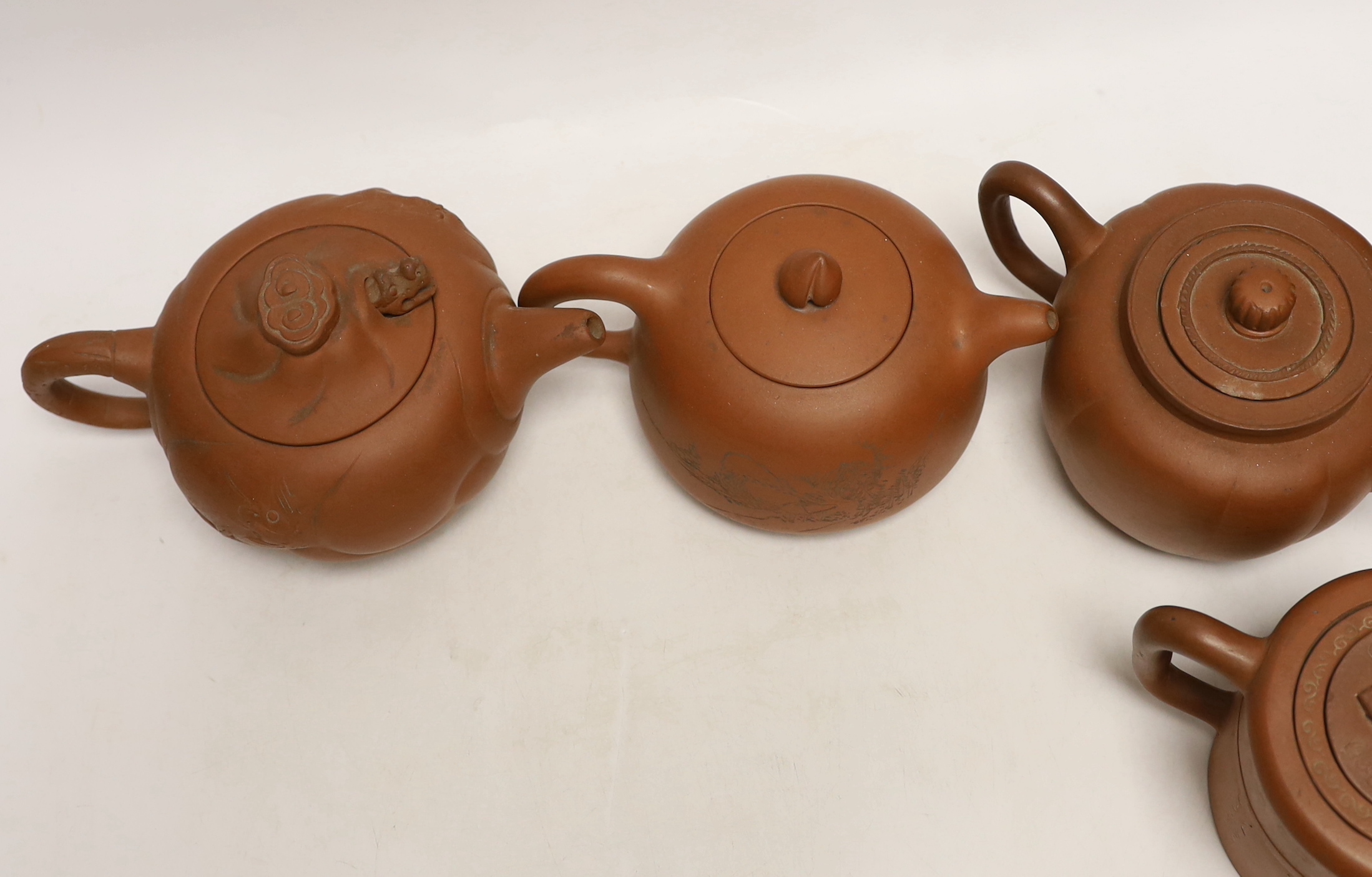 Six Chinese Yixing terracotta teapots, largest 11cm